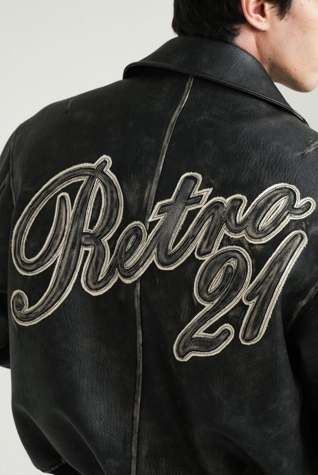 Retro 21 Distressed Faux Leather Padded Jacket in Black - On Model