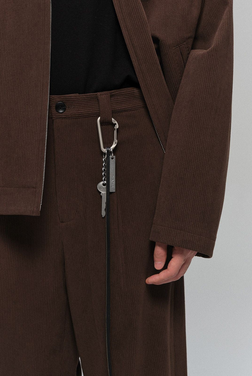 NANS Single Pleat Corduroy Micro Flare Trousers in Brown - Detail