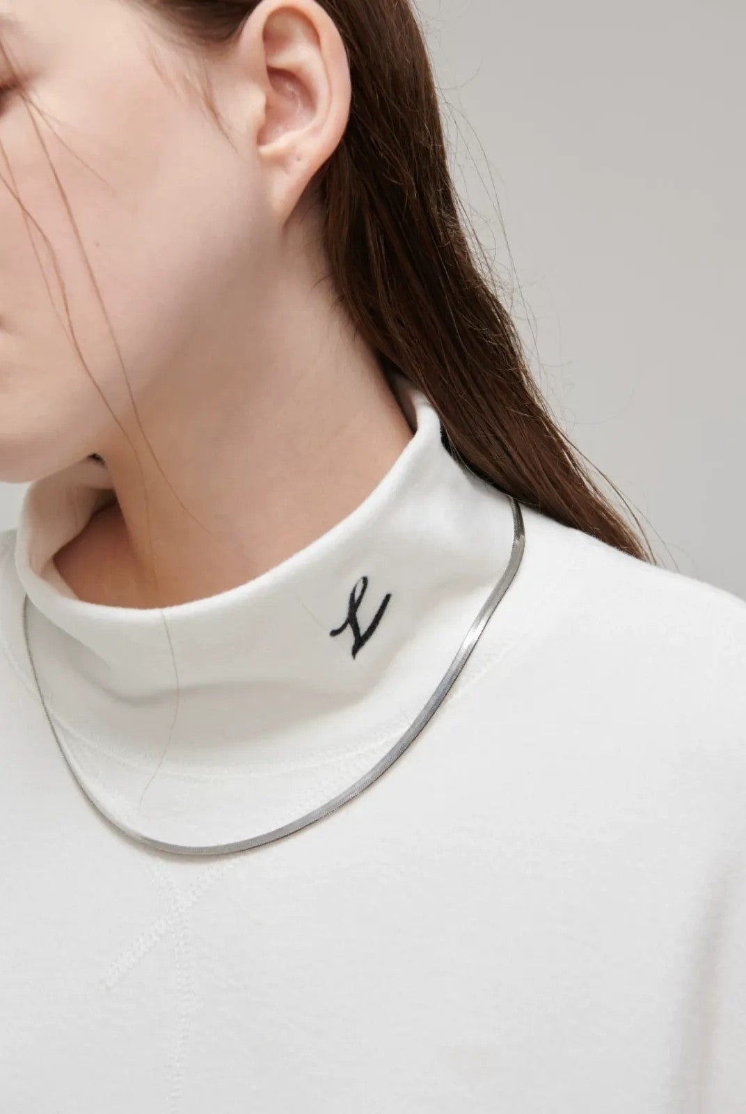 LOSTCTRL Embroidered Mock Neck Top in White - Detail