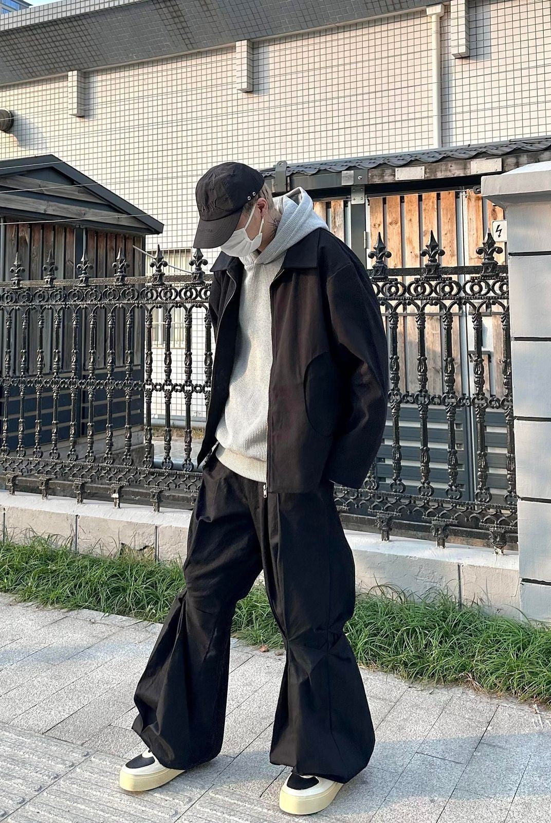 TRIANGLE PROJECT Deconstructed Origami Flare Pants in Black - On Model