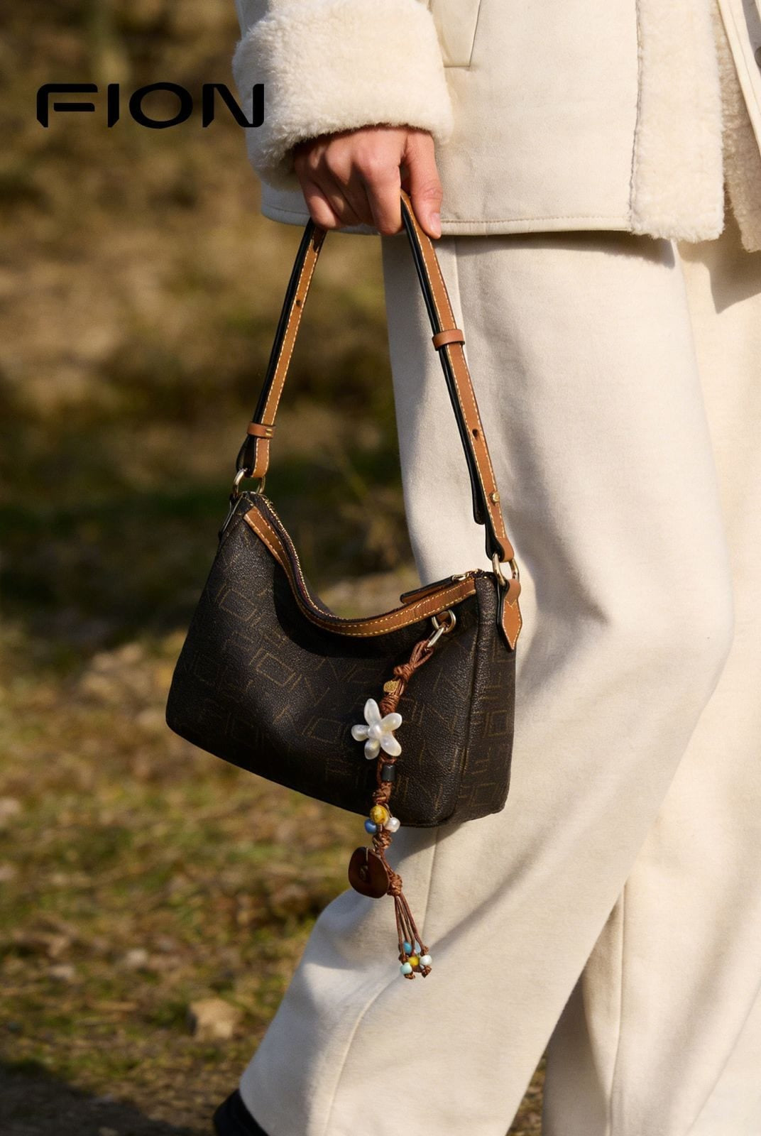 FION Monogram Faux Leather Shoulder Bag in Brown - On Female Model