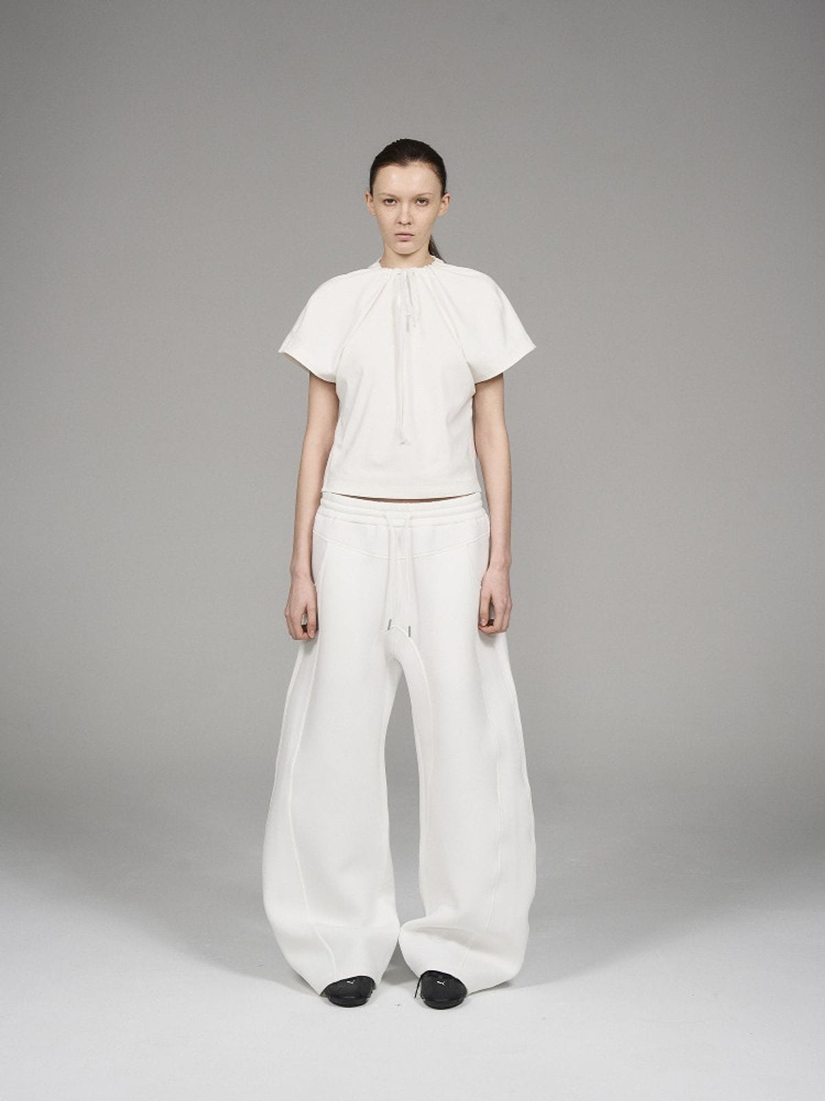 Blindnoplan Heavyweight Curved Leg Sweatpants in White - On Model