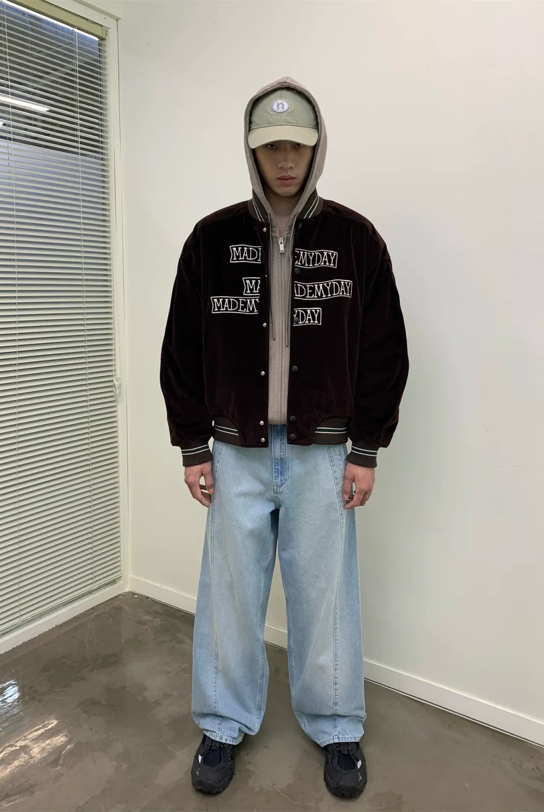 NeverSeez Velvet Corduroy Padded Varsity Jacket in Brown - On Model