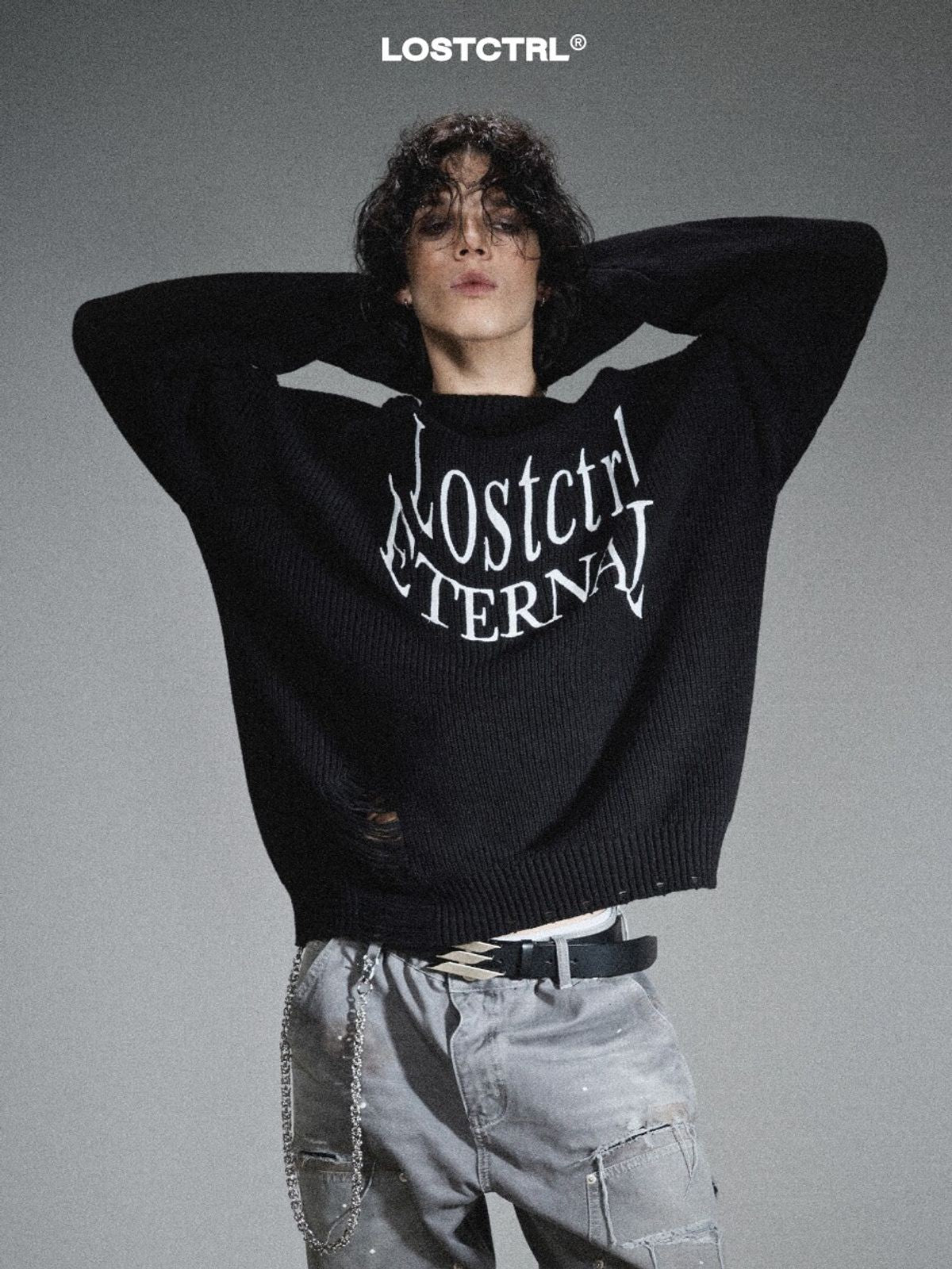 LOSTCTRL Distressed Logo Cotton Sweater in Black - On Male Model