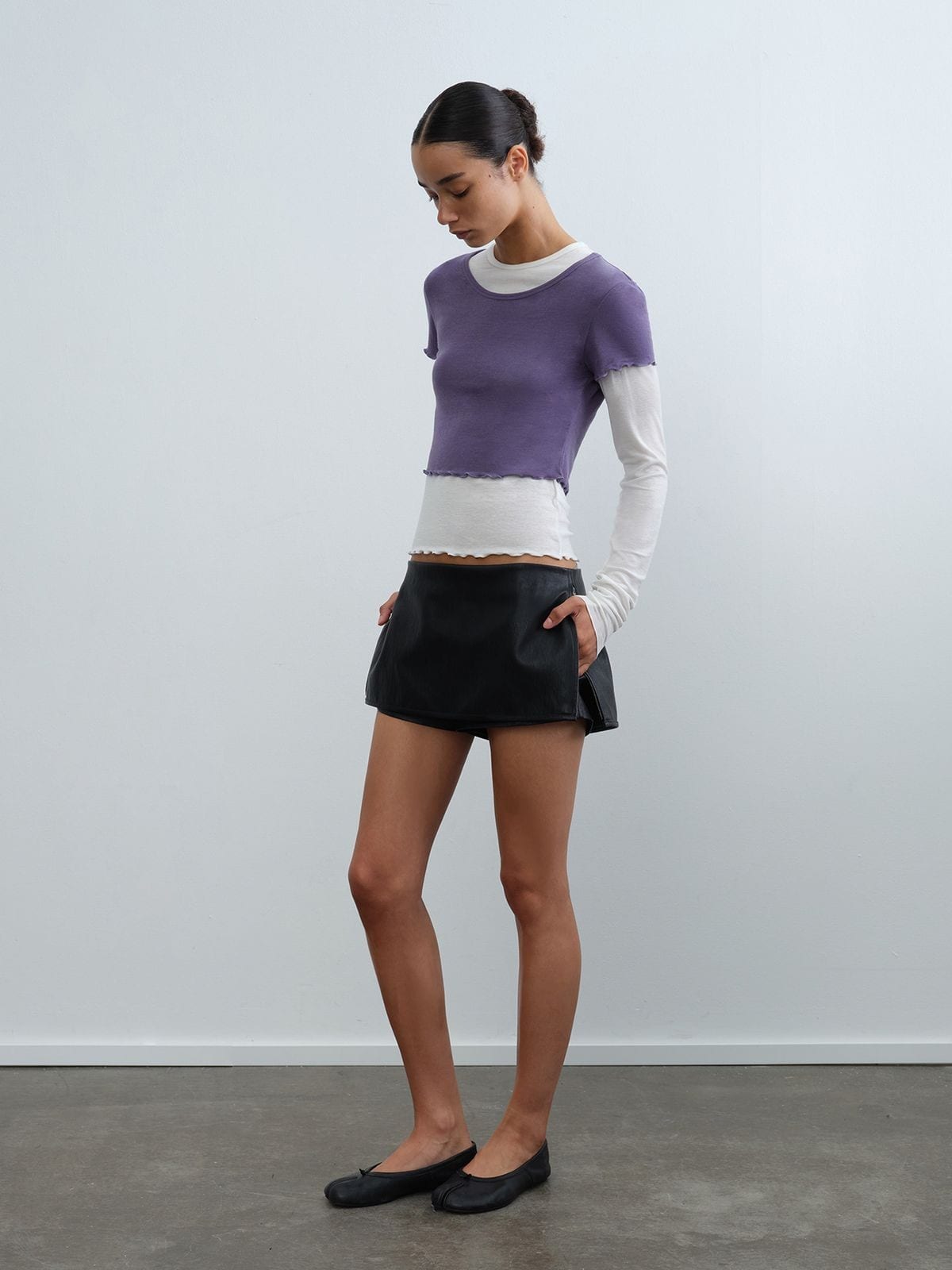 rarely alike Side Zip Faux Leather Mini Skort in Black - On Model