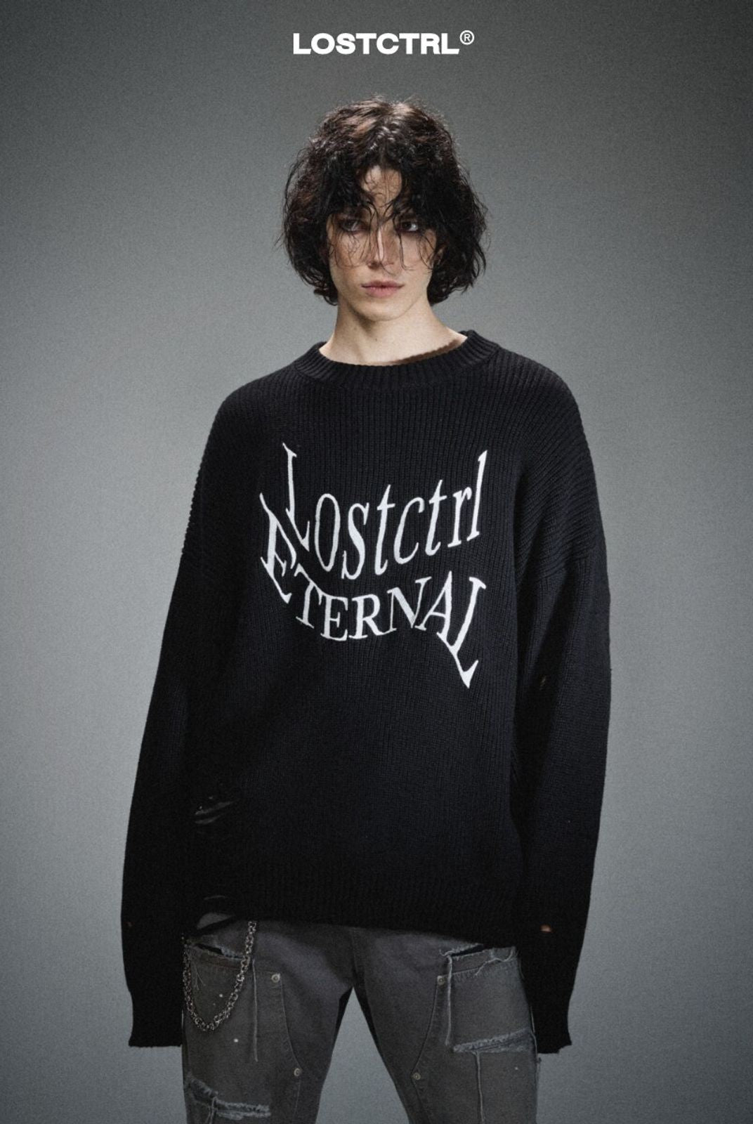 LOSTCTRL Distressed Logo Cotton Sweater in Black - On Model