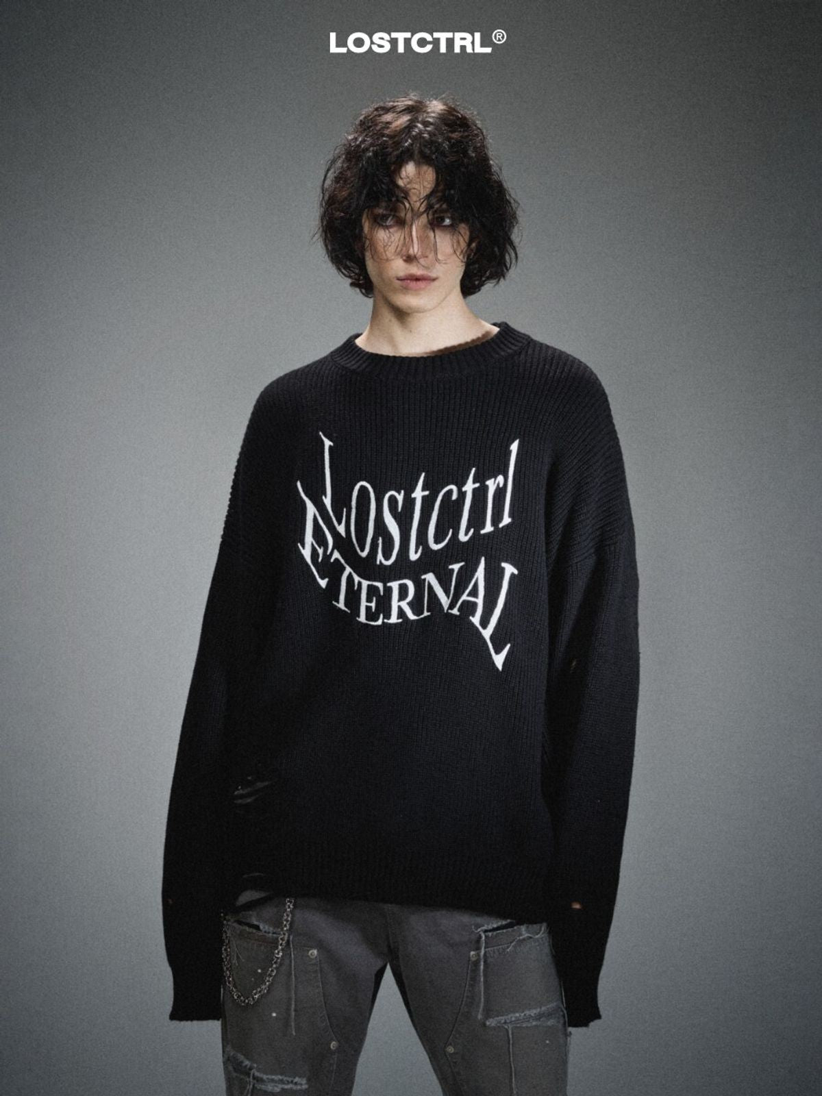 LOSTCTRL Distressed Logo Cotton Sweater in Black - On Male Model