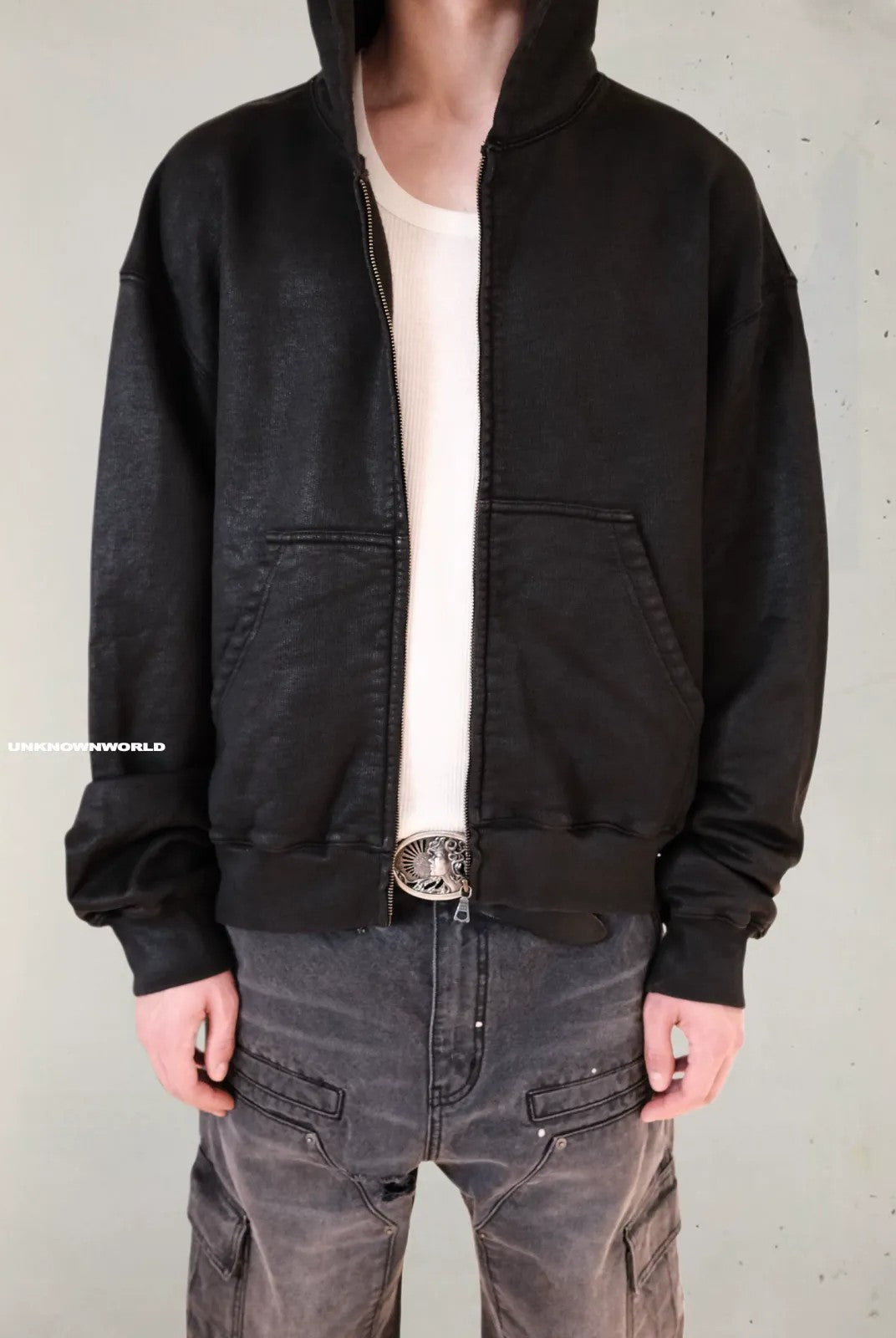 UNKNOWNWORLD Hand Waxed Cotton Zip Up Hoodie in Black - On Model