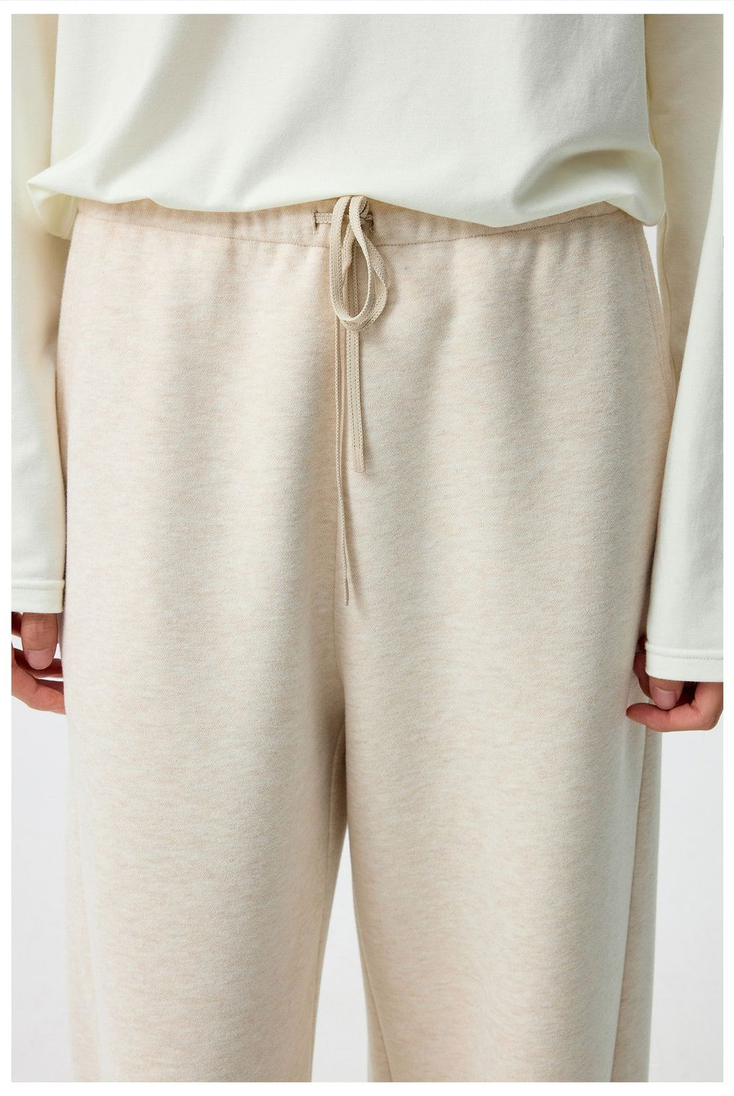 Simple Project Curved Seam Drawstring Sweatpants in Beige - On Model