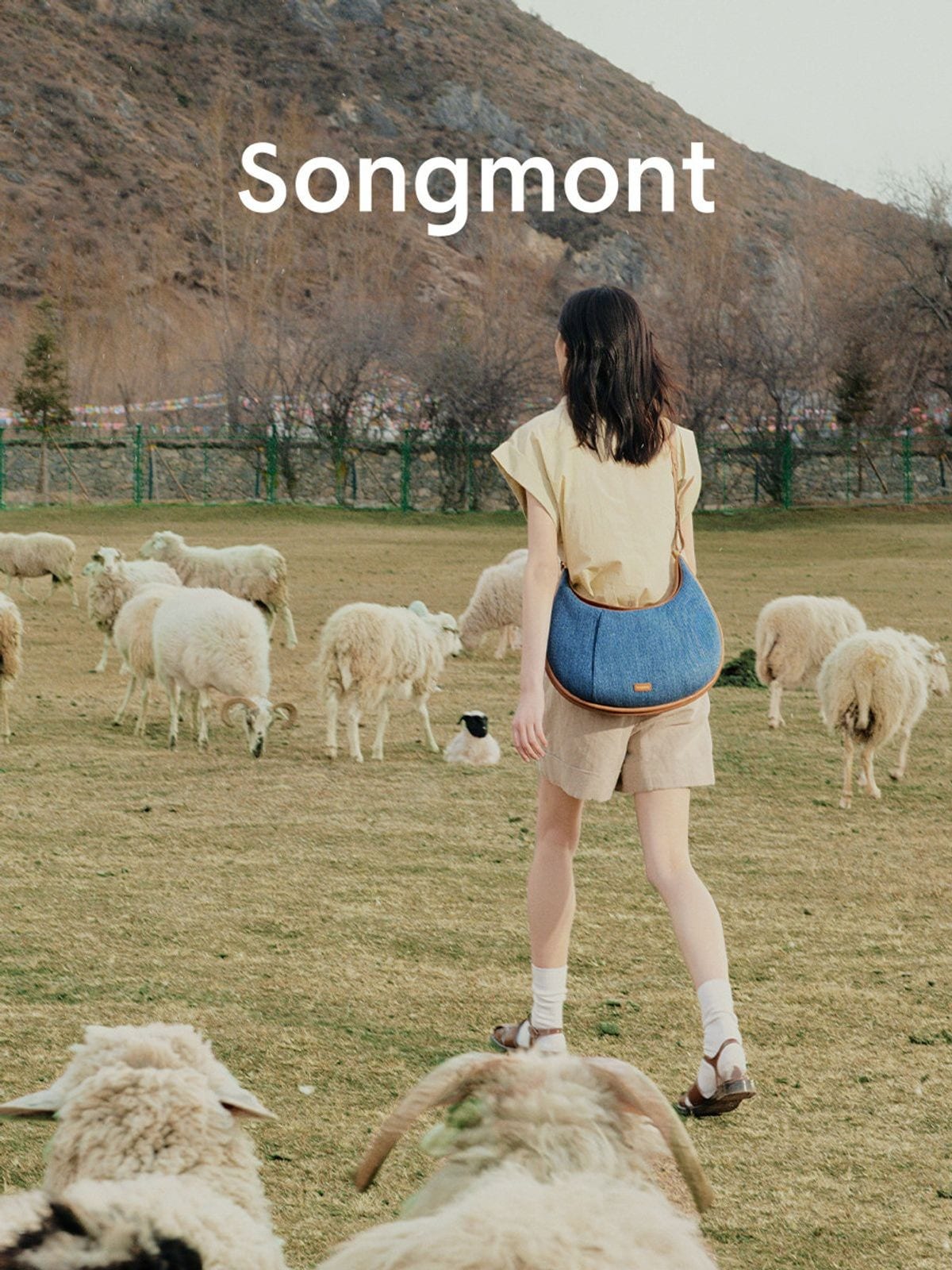 Songmont Denim Leather Crescent Bag in Blue - On Model