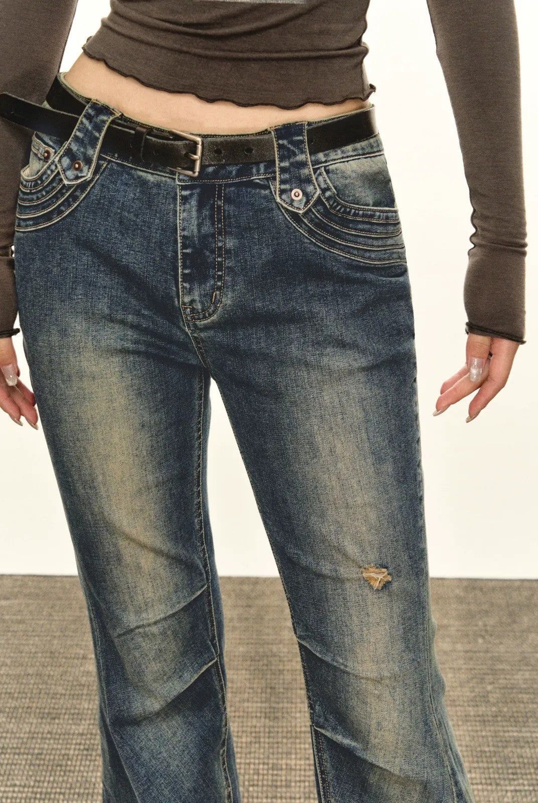 ARISEISM Distressed Micro Flare Jeans in Blue - On Model