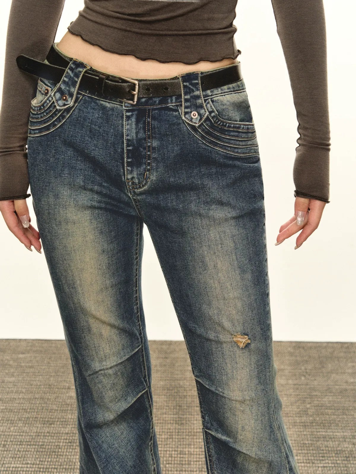 ARISEISM Distressed Micro Flare Jeans in Blue - On Model