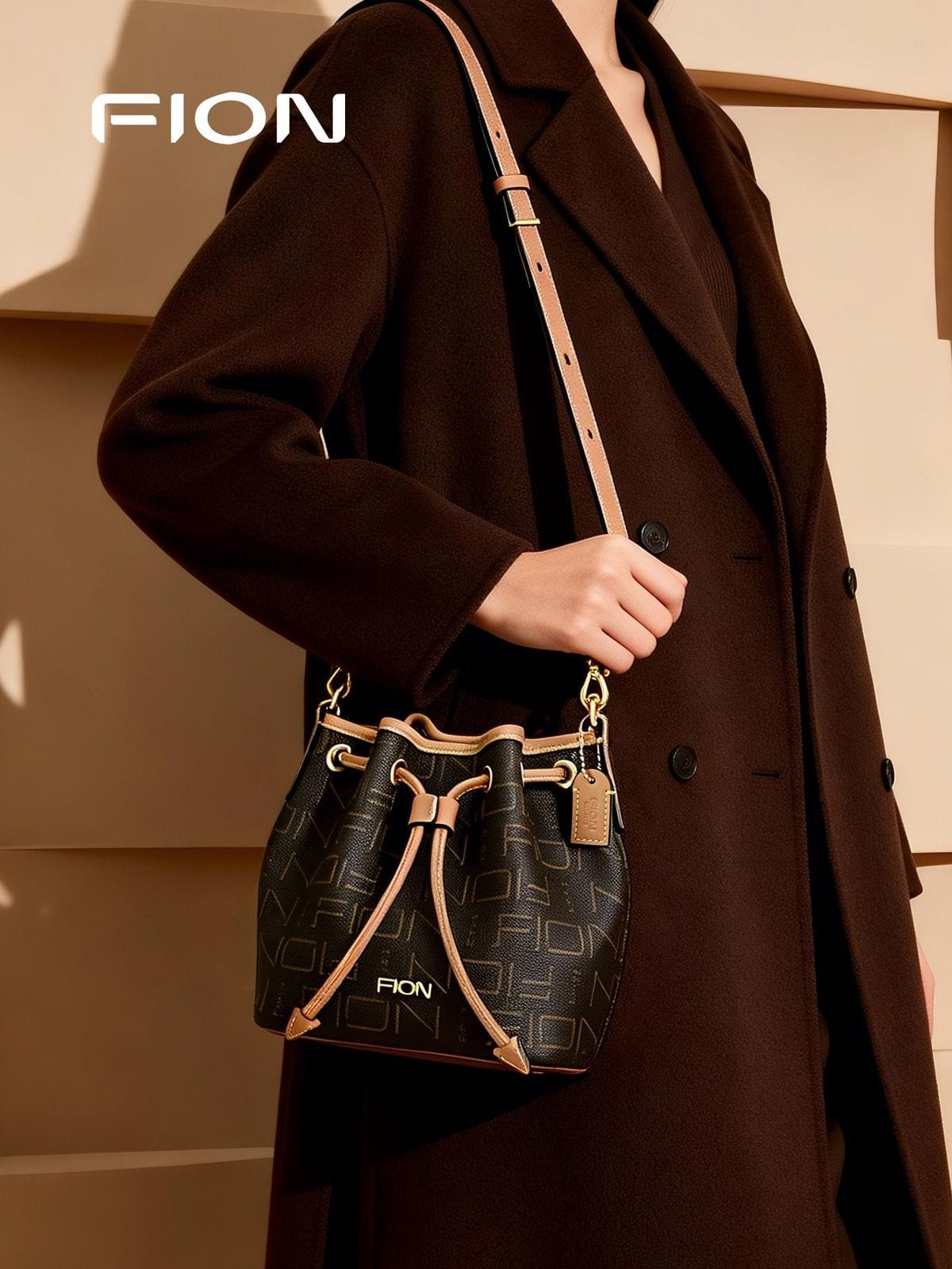 FION Monogram Canvas Drawstring Bucket Bag in Brown - On Female Model