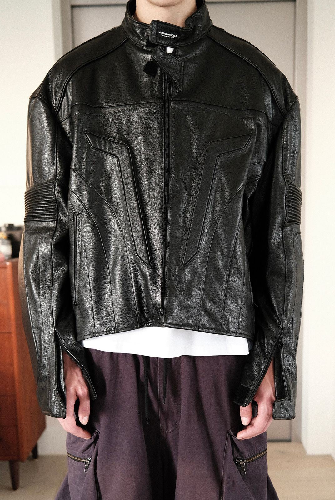 UNKNOWNWORLD Structured Cowhide Biker Jacket in Black - On Model
