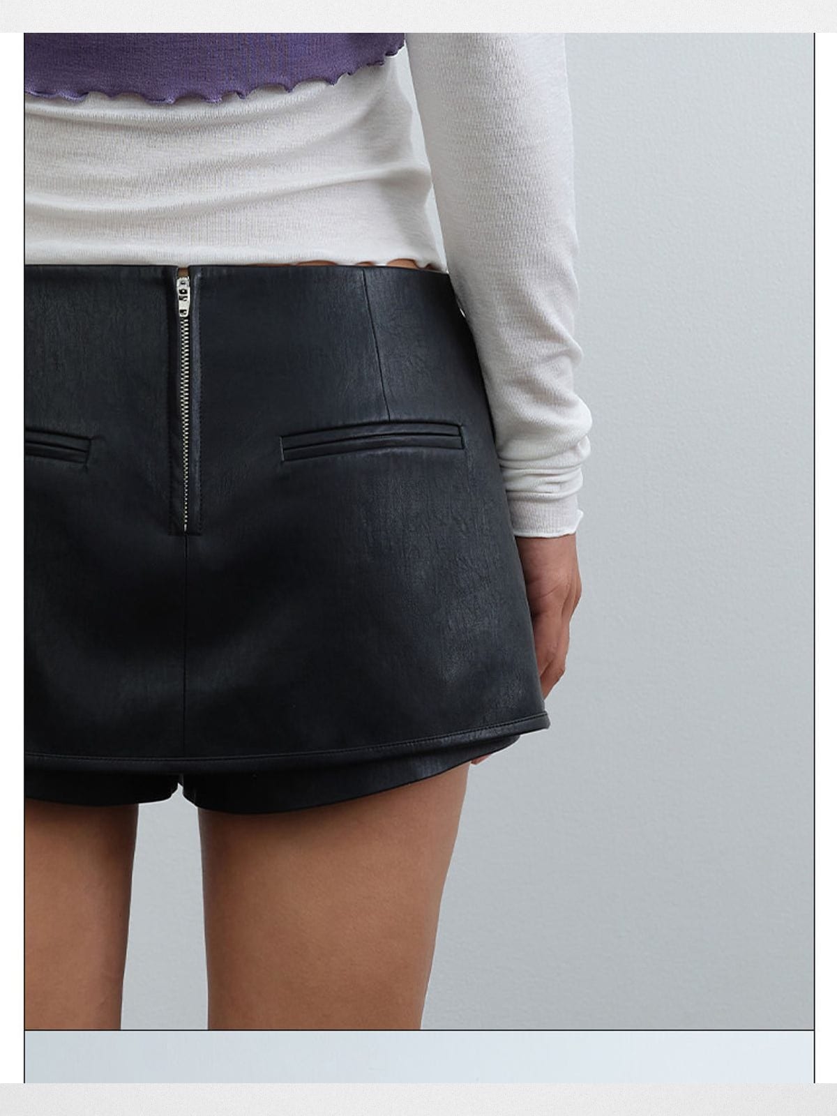 rarely alike Side Zip Faux Leather Mini Skort in Black - On Model