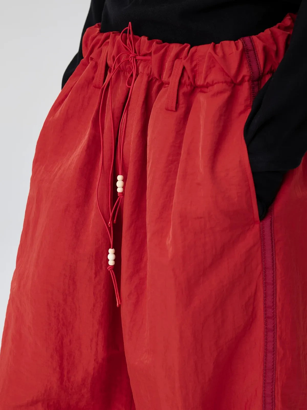 Simple Project Wide Leg Nylon Drawstring Trousers in Red - On Model