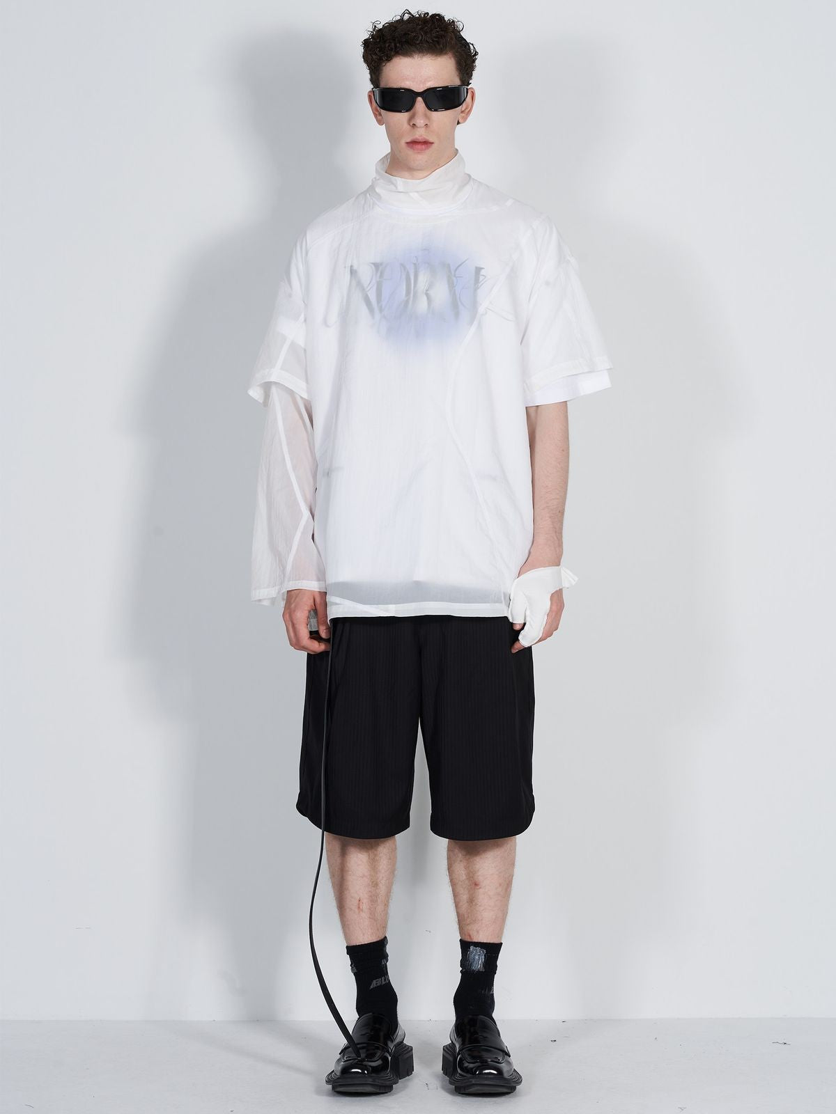 BLINDNOPLAN Dislocated Stripe Tailored Shorts in Black - On Model