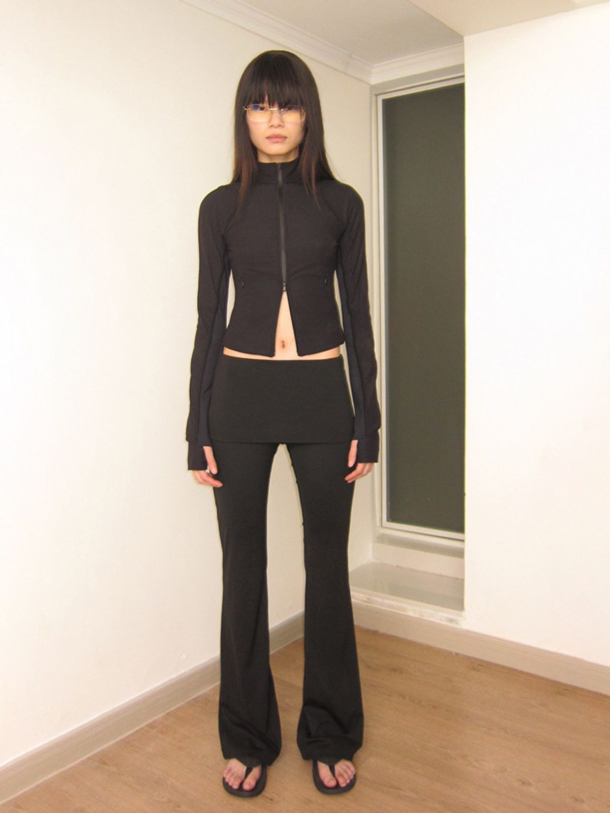 RARELY ALIKE Skirted Low Rise Flare Leggings in Black - On Model