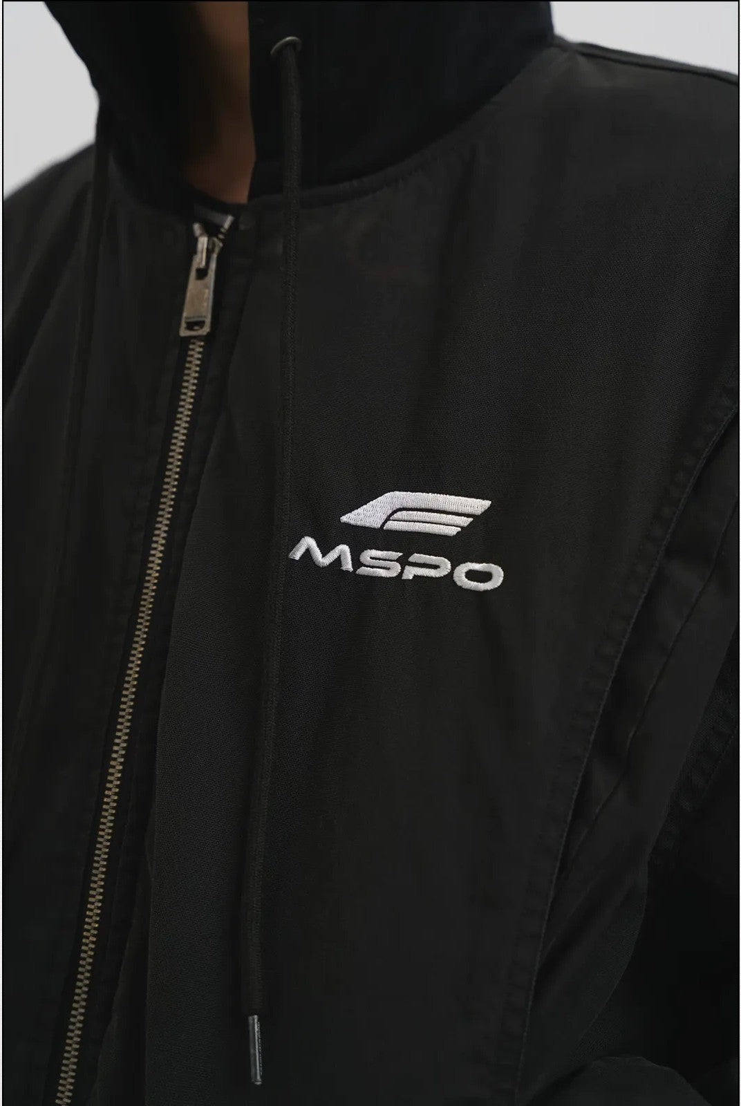 MASONPRINCE Hooded Racing Patch Puffer Jacket in Black - On Male Model#color_black