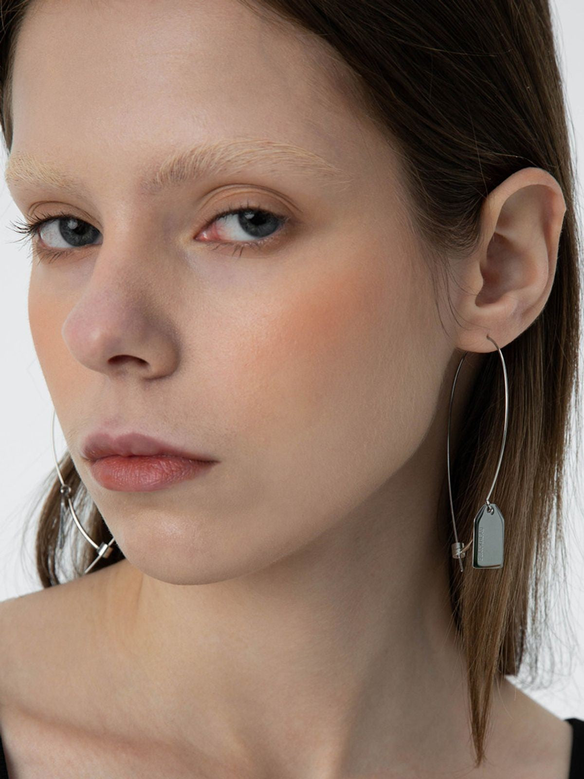 BLACKHEAD Steel Label Tag Wire Earrings in Gray - On Model