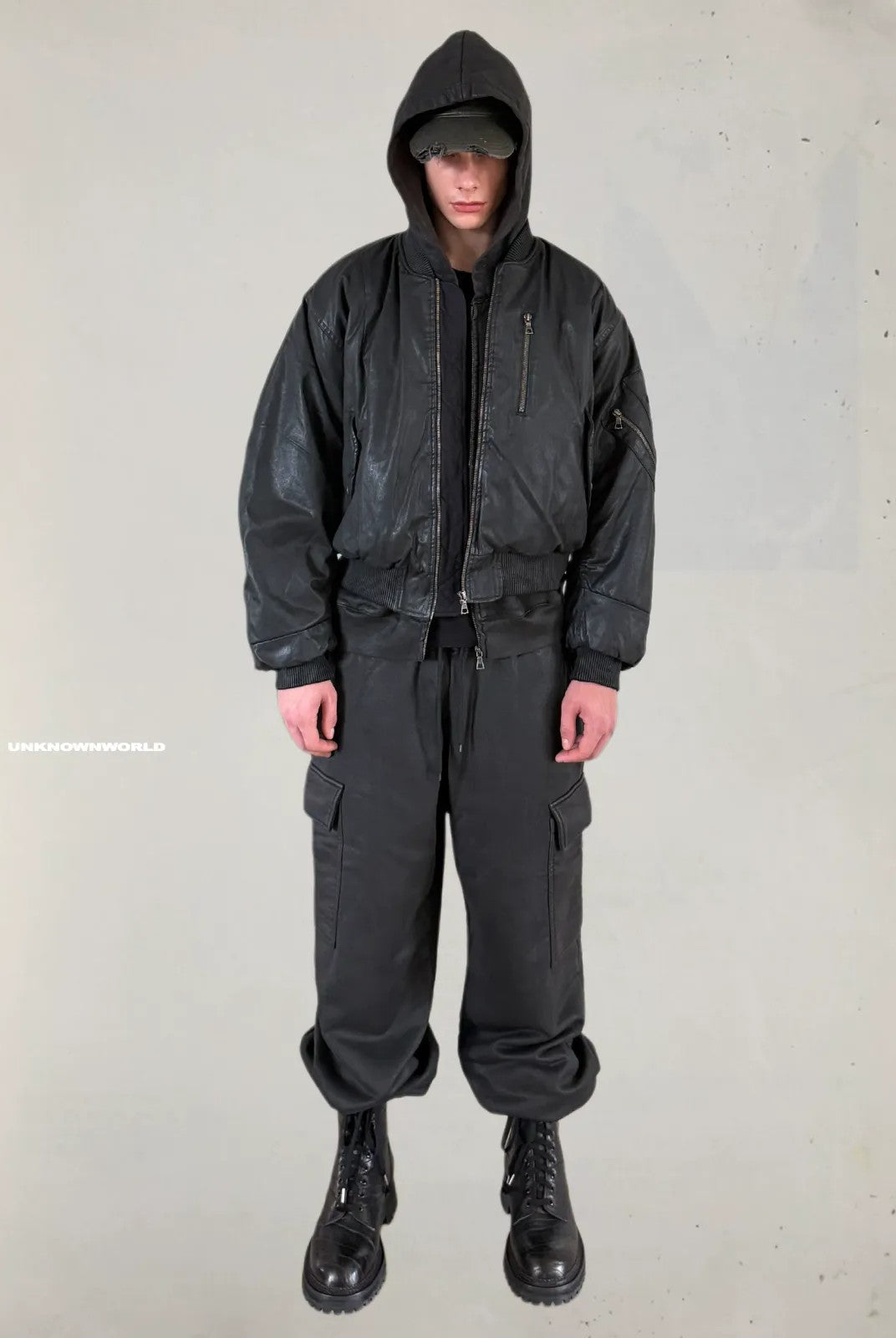 UNKNOWNWORLD Hand Waxed Cotton Zip Up Hoodie in Black - On Model