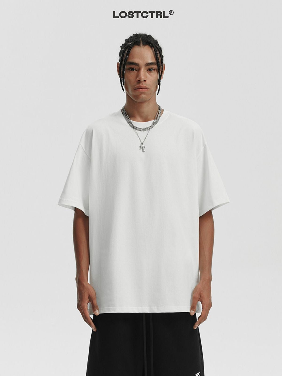 LOSTCTRL Loose Fit Cotton Crew Neck T Shirt in White - On Model