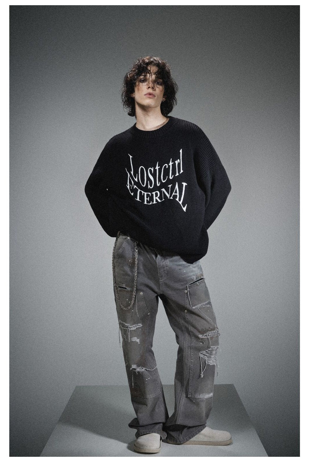 LOSTCTRL Distressed Logo Cotton Sweater in Black - On Model