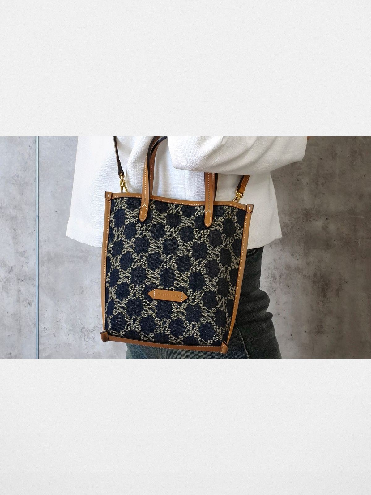 WANLIMA Leather Trimmed Monogram Denim Tote in Denim - On Female Model