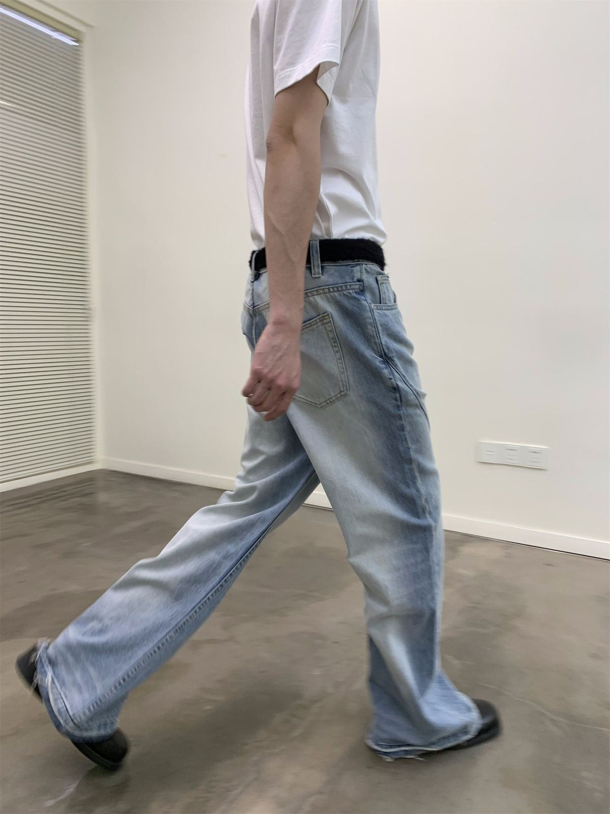 NeverSeez Distressed Washed Micro Flare Jeans in Blue - On Model