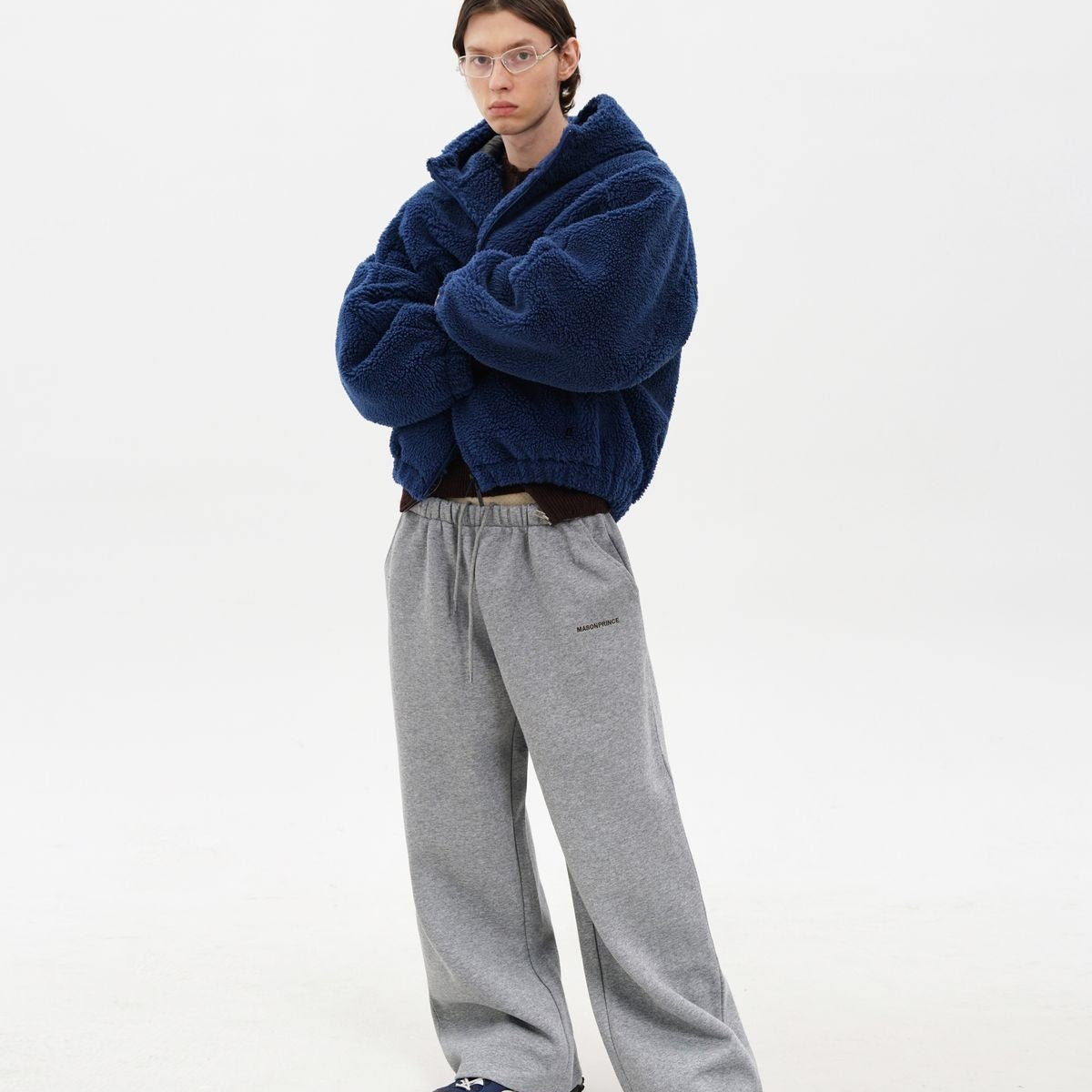 MasonPrince Contrast Logo Fleece Hooded Jacket in Navy Blue - On Male Model #color_navy-blue