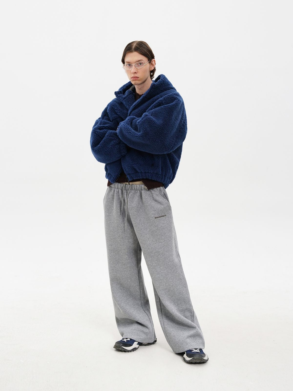 MasonPrince Contrast Logo Fleece Hooded Jacket in Navy Blue - On Male Model #color_navy-blue