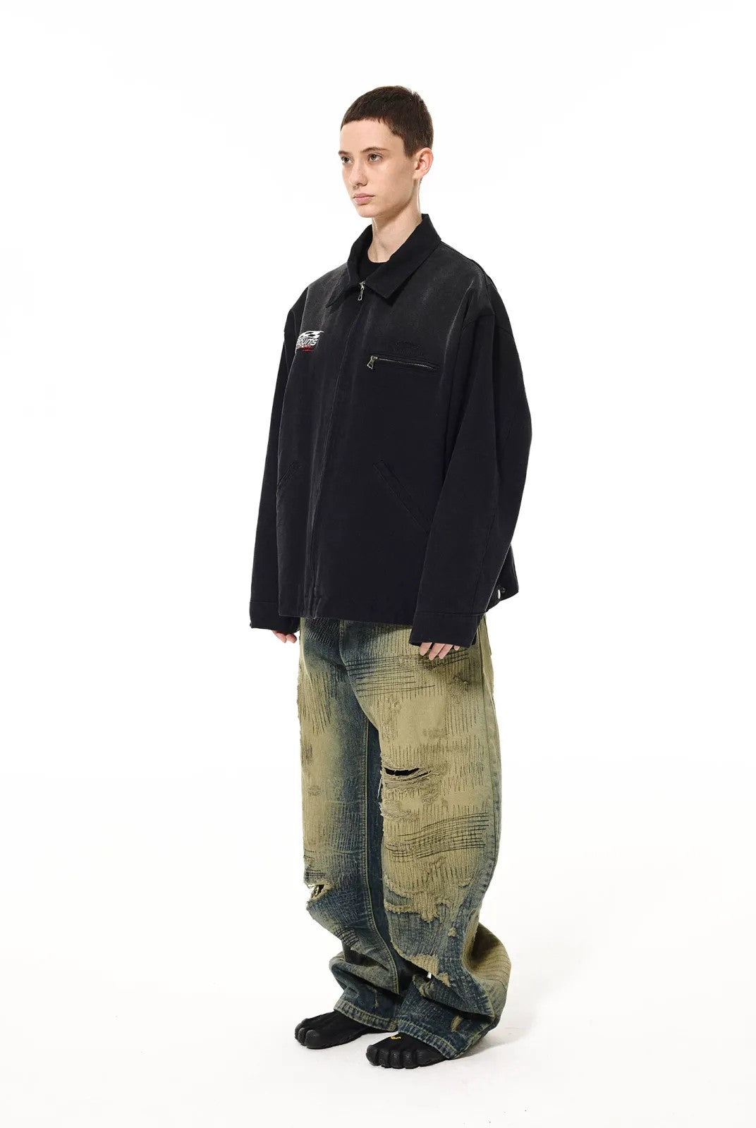 UNKNOWNWORLD Sun Faded Canvas Racing Jacket in Black - On Model