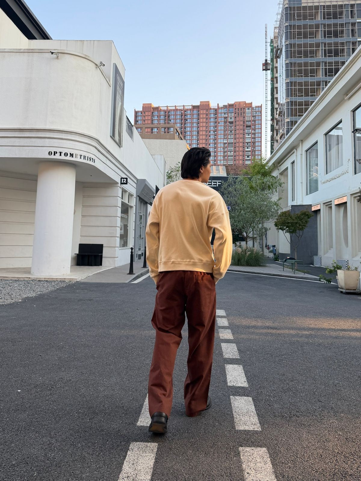 TRIANGLE PROJECT Ribbed Cotton Henley Sweatshirt in White - On Model