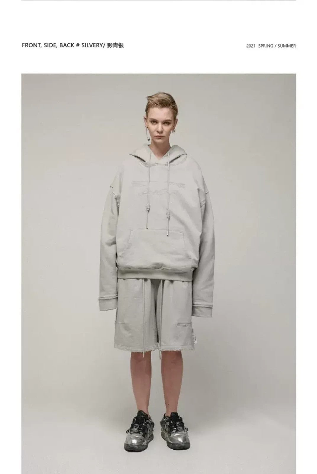 LOSTCTRL Embroidered Raw Edge Cotton Hoodie in Gray - On Model