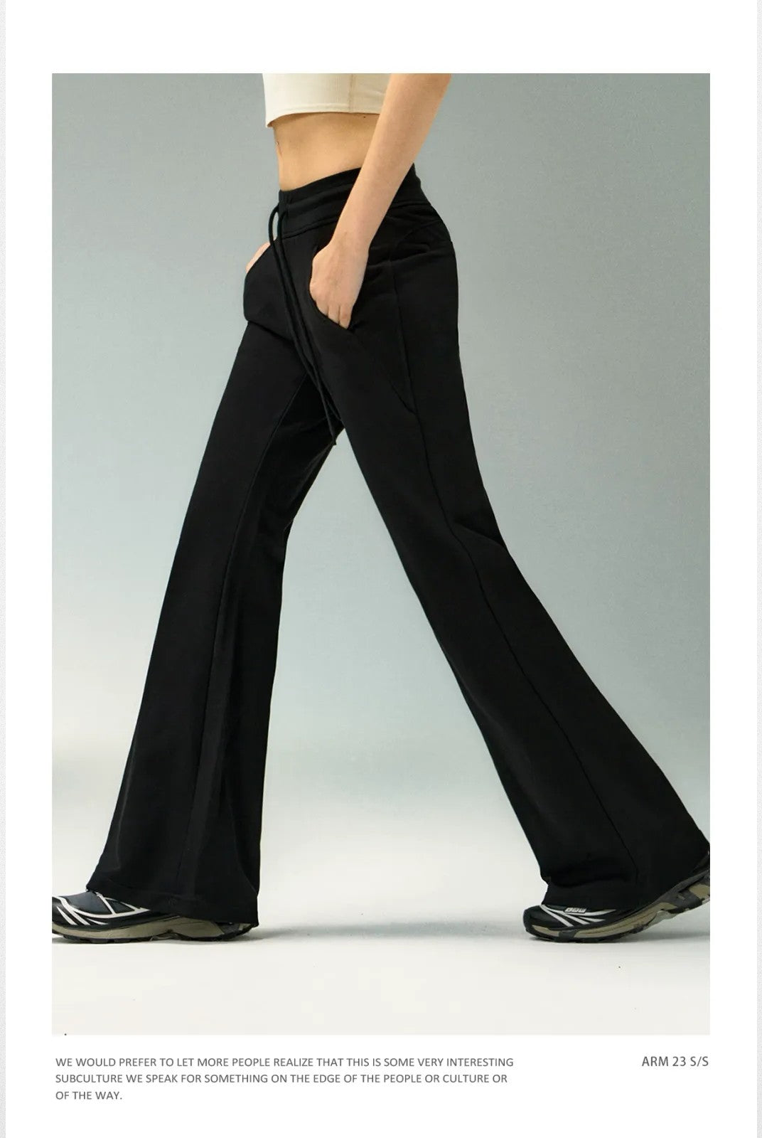 Ariseism Low Rise Micro Flare Sweatpants in Black - On Model