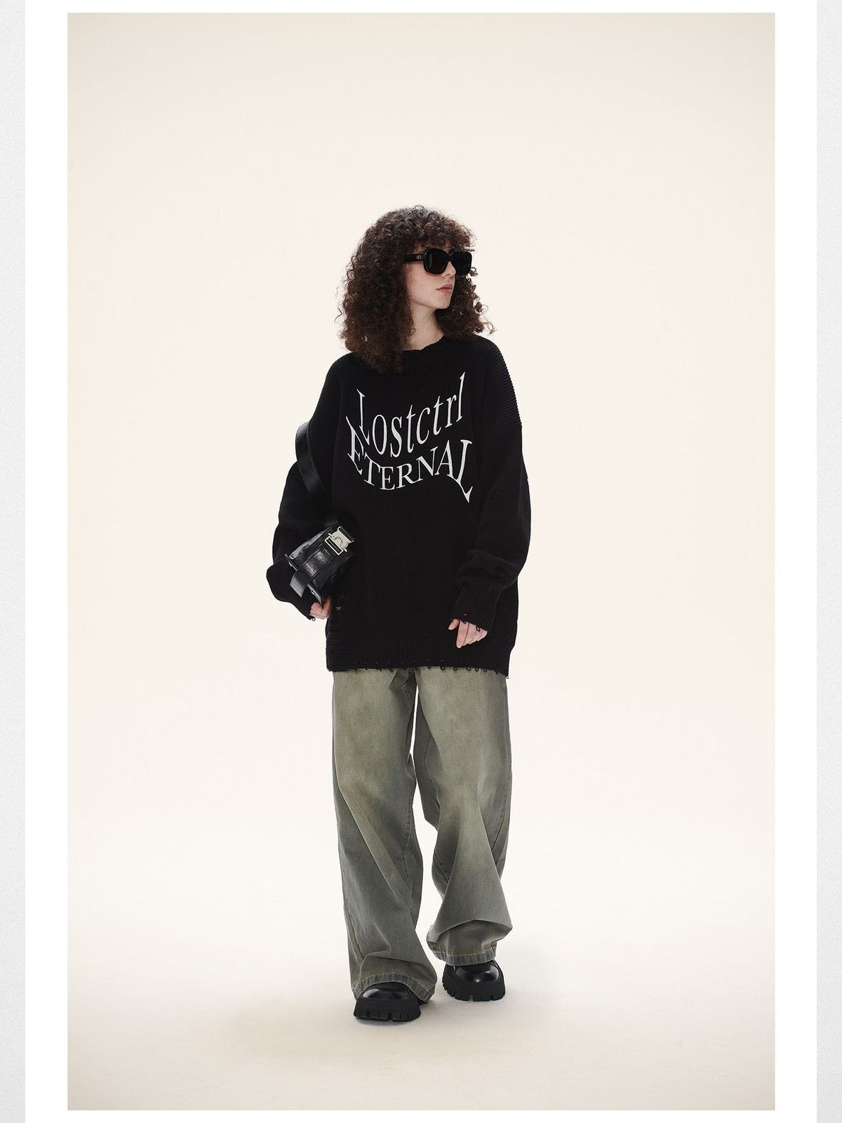 LOSTCTRL Distressed Logo Cotton Sweater in Black - On Female Model