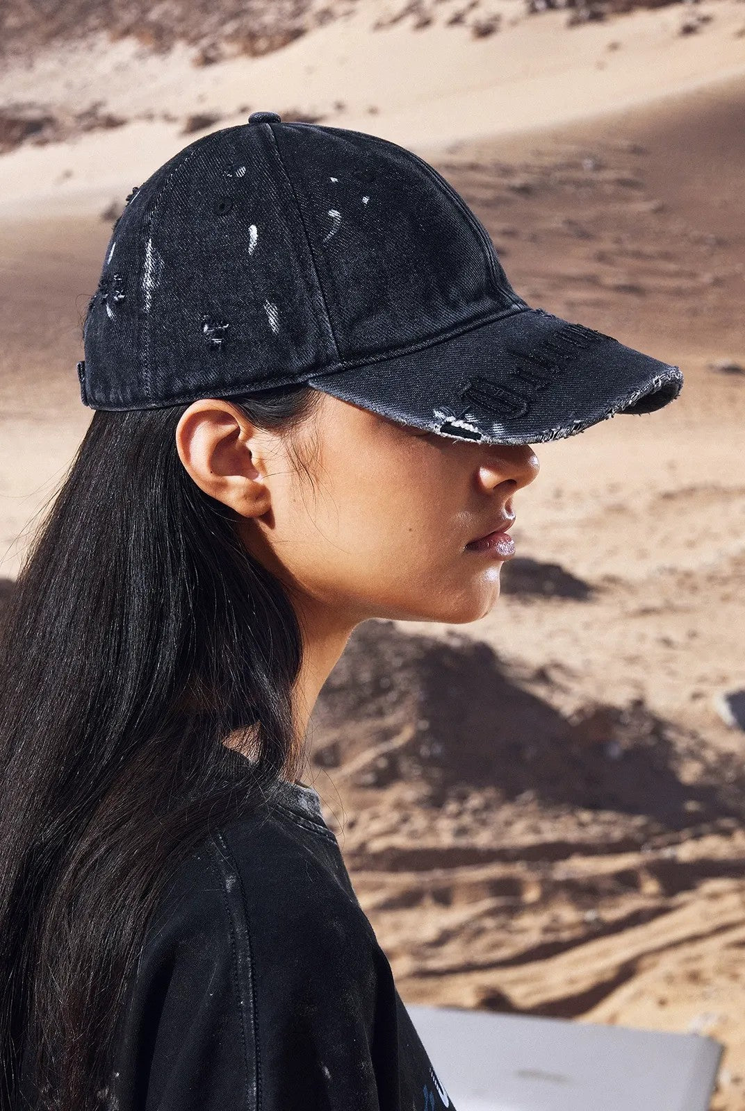 UNKNOWNWORLD Distressed Paint Splatter Cap in Black - On Model