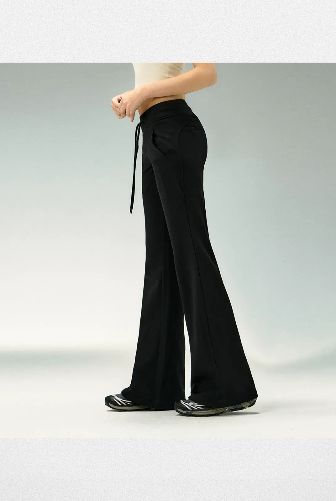 Ariseism Low Rise Micro Flare Sweatpants in Black - On Model