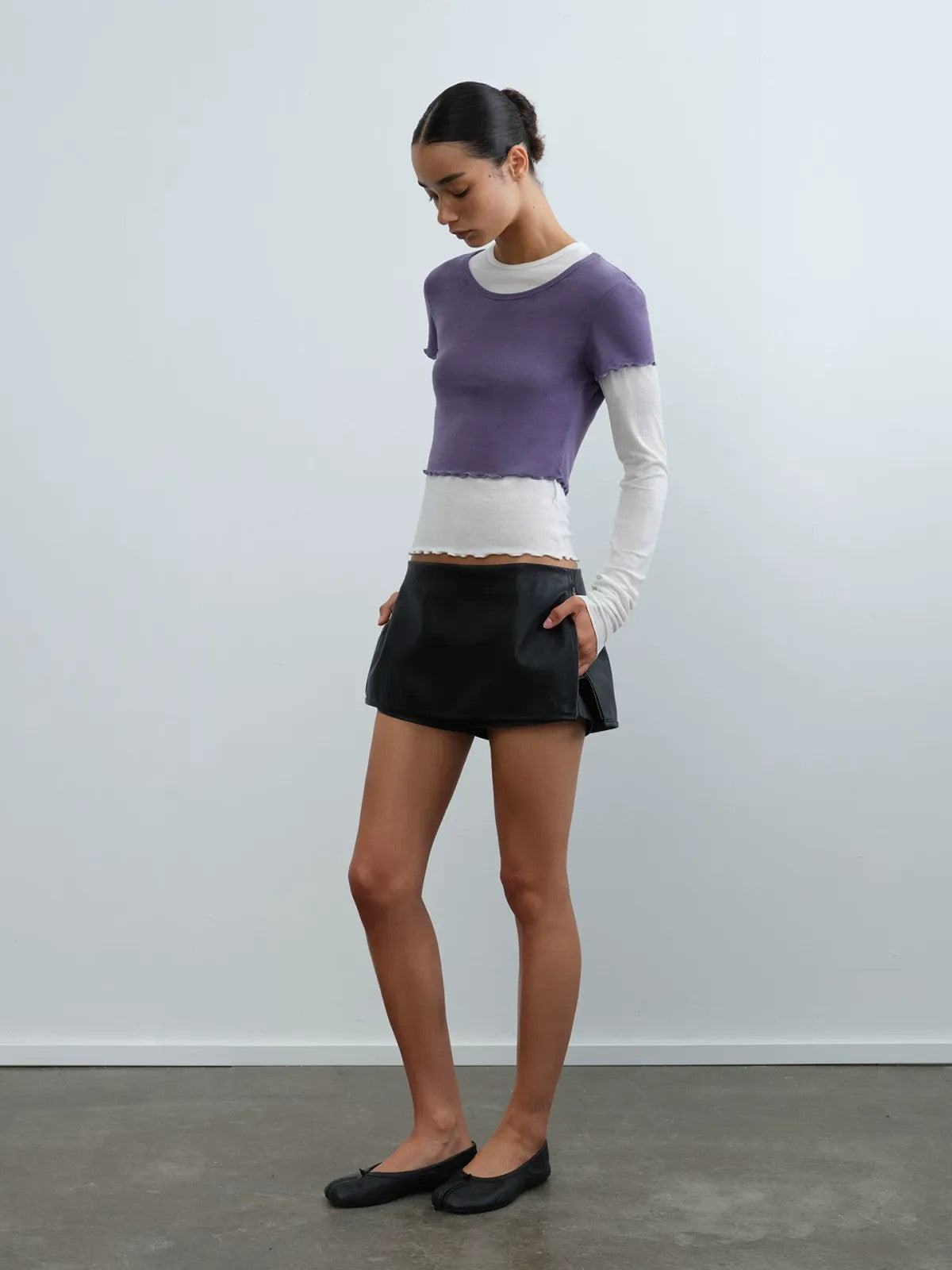 RARELY ALIKE Side Zip Faux Leather Skort in Black - On Model