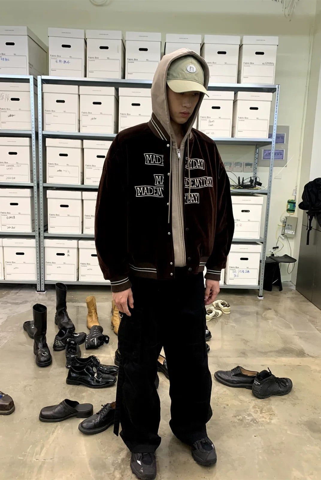 NeverSeez Velvet Corduroy Padded Varsity Jacket in Brown - On Model