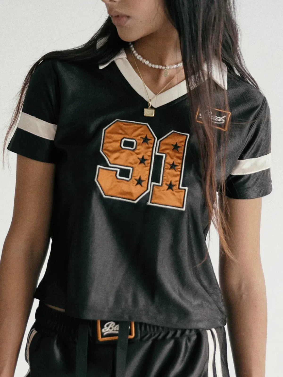 BADSEED Cropped Graphic Baseball Jersey in Black - On Model