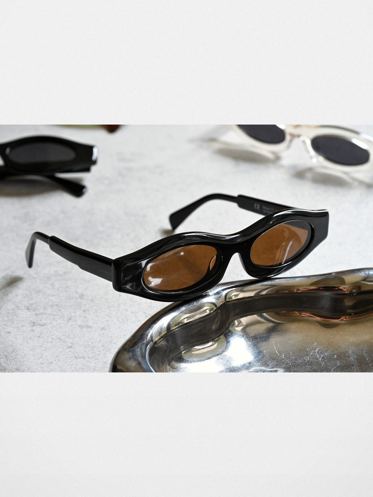 FUTURE UPDATE Sculptural Cat Eye Sunglasses in Black - Lifestyle