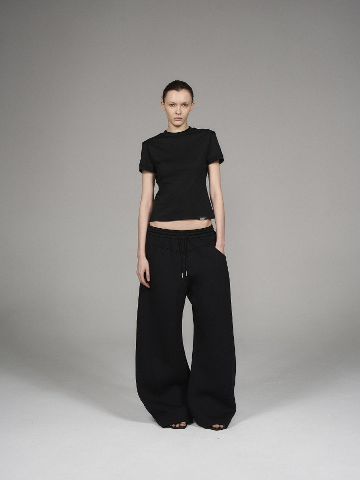 Blindnoplan Heavyweight Curved Leg Sweatpants in Black - On Model