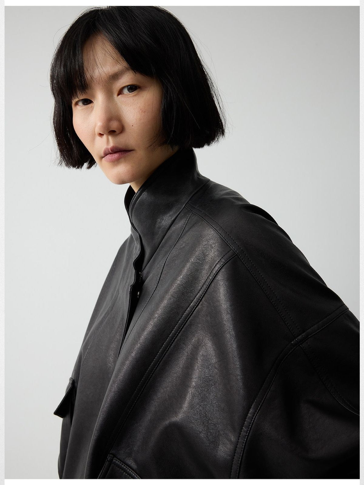 RandomPiece Elastic Hem Faux Leather Jacket in Black - On Model