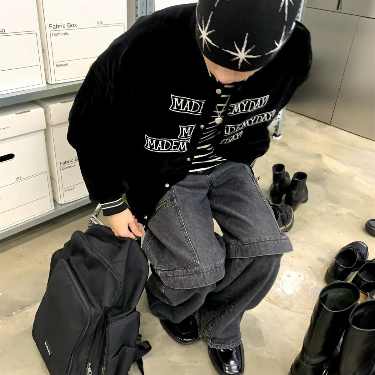 NeverSeez Velvet Corduroy Padded Varsity Jacket in Black - On Model