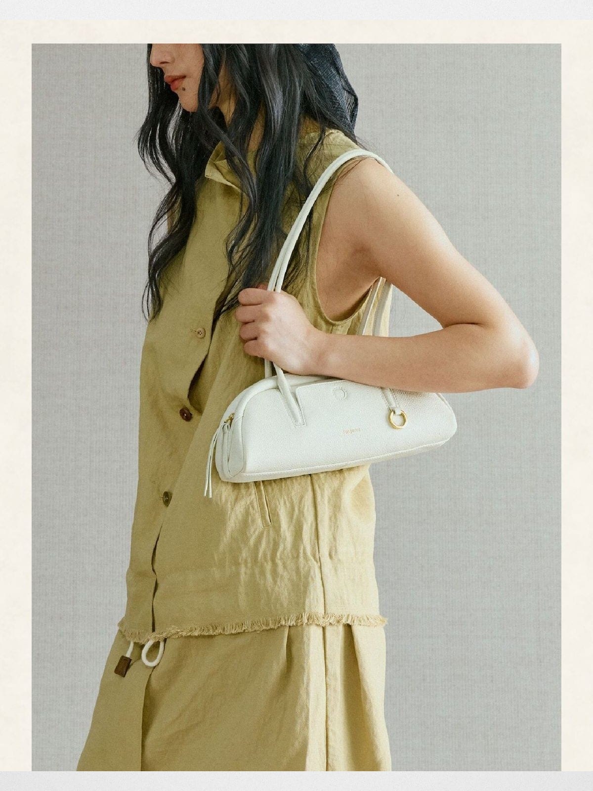 Songmont Mini Leather Bowling Bag in Cream - On Model