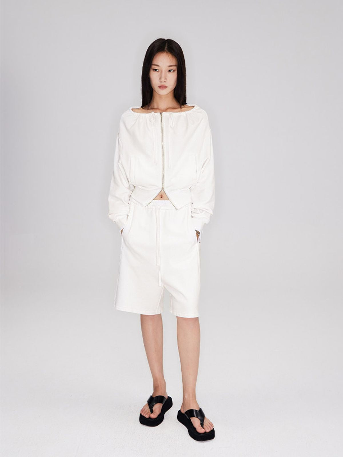 RARELY ALIKE Seamed Cotton Sweat Shorts in White - On Model