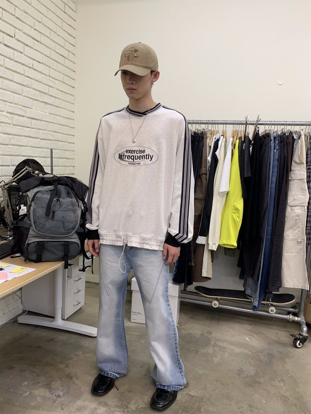 NeverSeez Distressed Washed Micro Flare Jeans in Blue - On Model