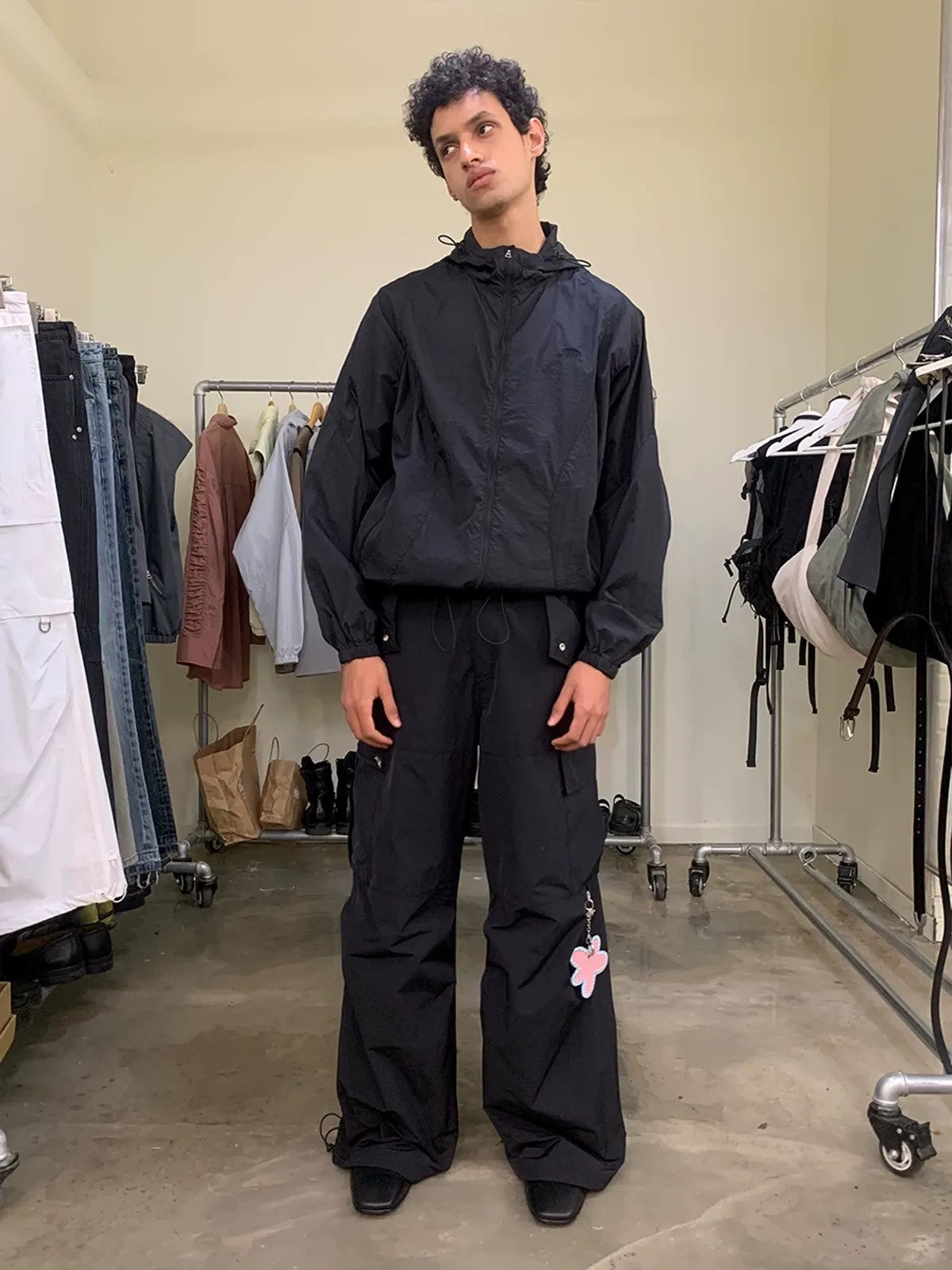 NeverSeez Accordion Pocket Wide Leg Cargo Pants in Black - On Male Model