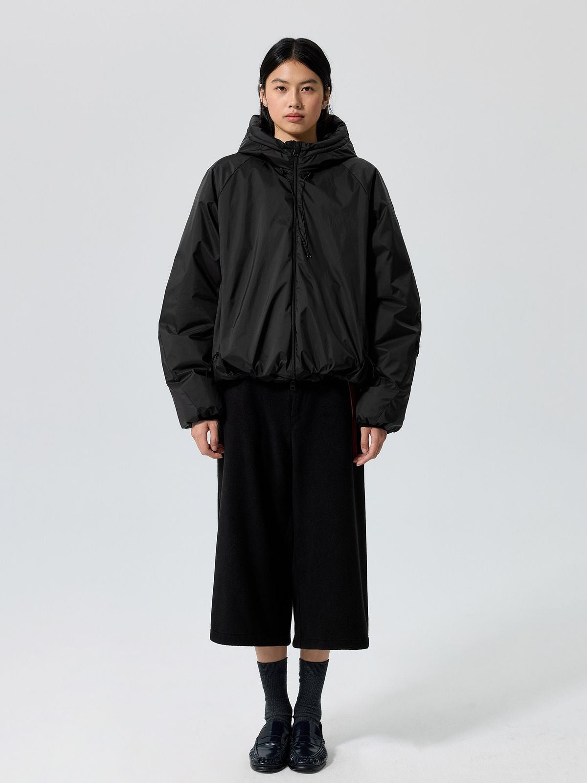 Simple Project Shell Shape Hooded Puffer Jacket in Black - On Female Model